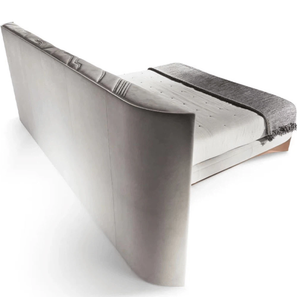 Back view of the Modern Luxury Designer Bed highlighting its curved leather-upholstered headboard and minimalist frame Back view of the Modern Luxury Designer Bed highlighting its curved leather-upholstered headboard and minimalist frame